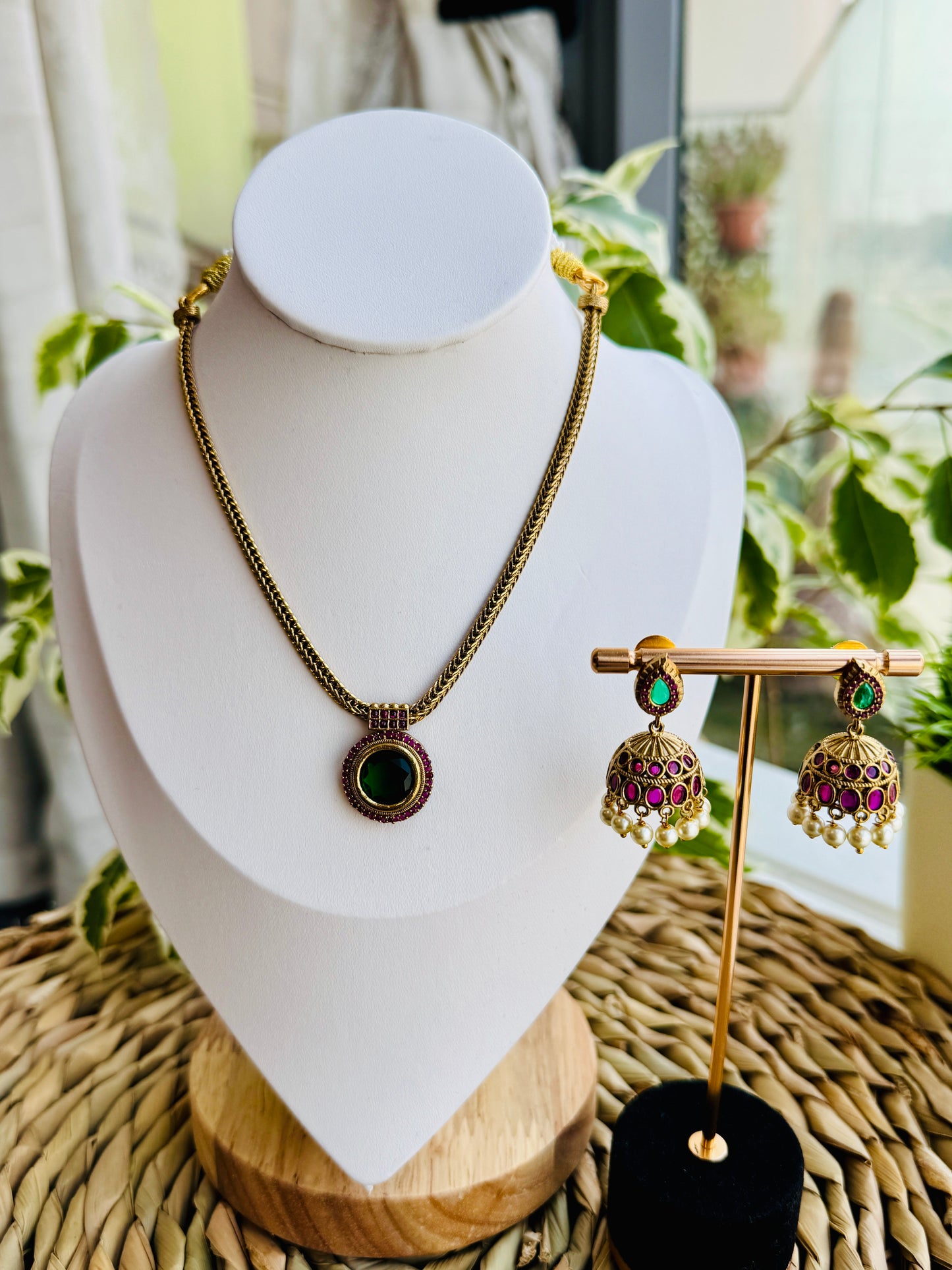 Elegant emerald stone pendant with jhumkas